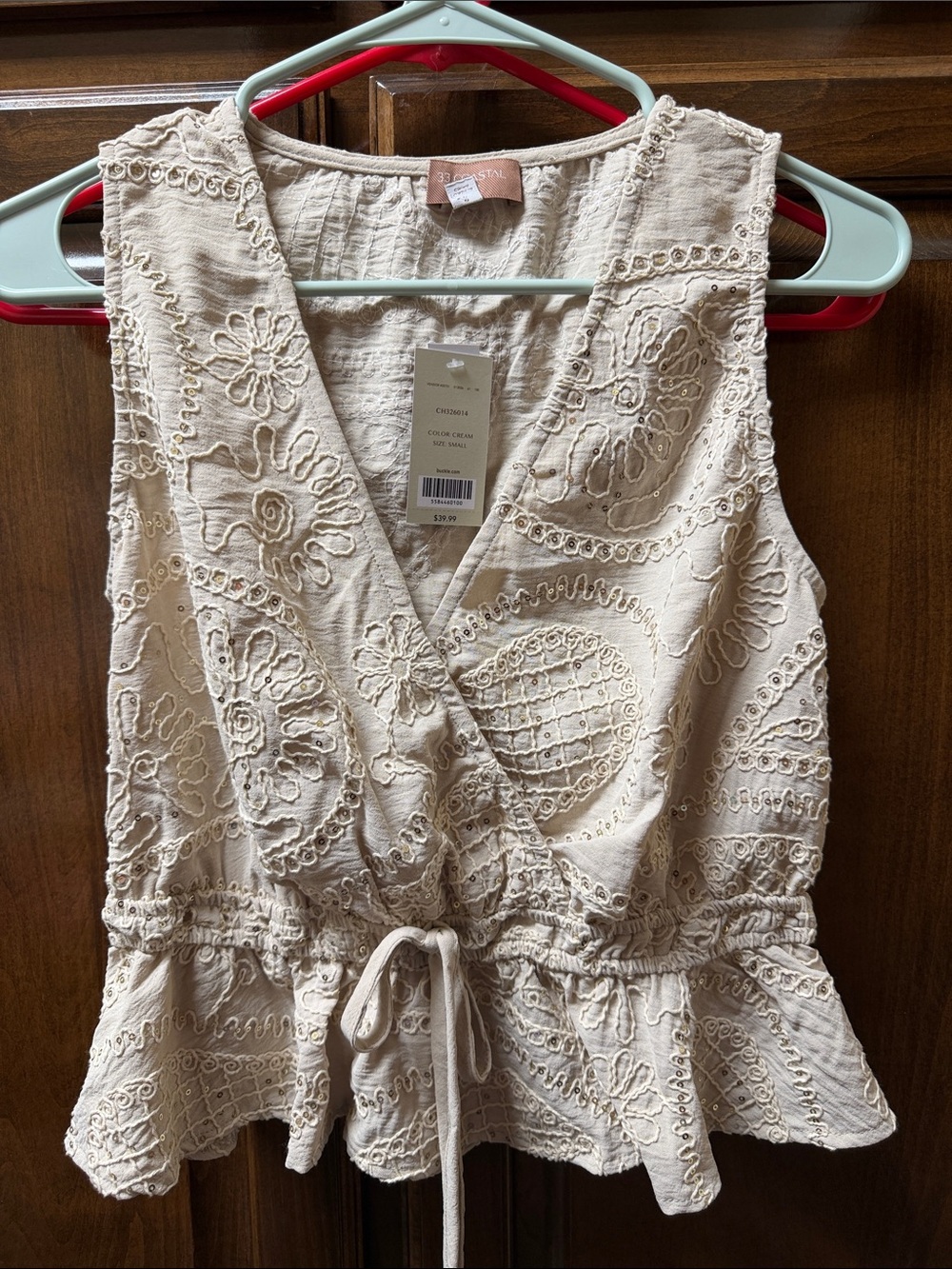 Textured Cream Sleeveless Wrap Peplum Top